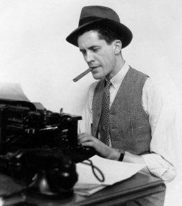 07 Dec 1934 --- 1930s Man Newspaper Reporter Wearing Hat Typing Smoking Cigar --- Image by © H. Armstrong Roberts/ClassicStock/Corbis
